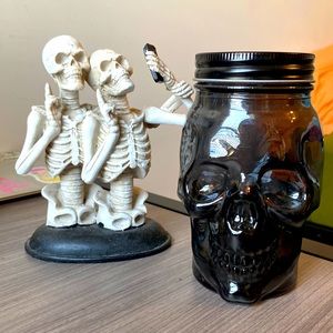 Fun sculpture of skeletons taking a selfie and a glass jar skeleton!